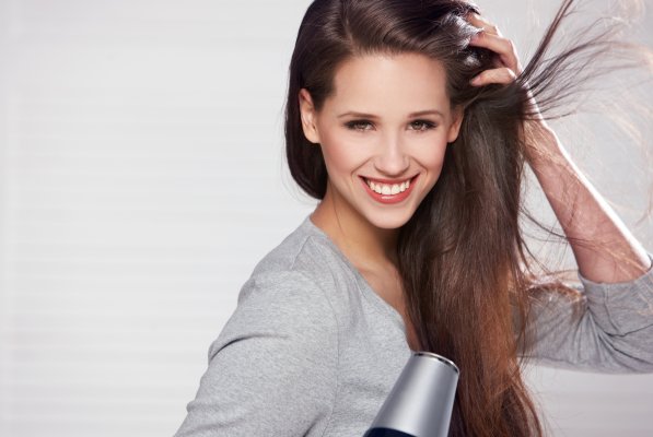 woman drying hair hair dryers